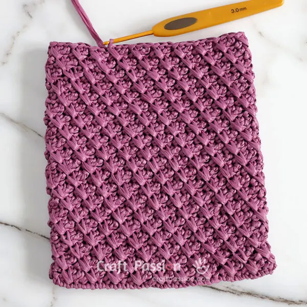 crochet crossbody bag with cable stitch work-in-progress, free crochet pattern