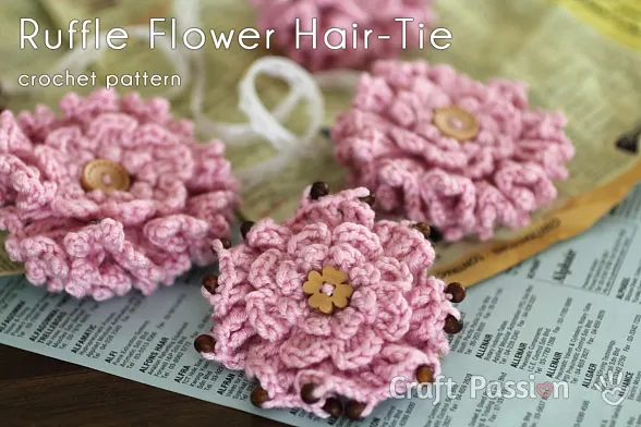 Free pattern to make a beautiful crochet ruffled flower from stashed yarn, perfect as a handmade gift like a brooch or hair tie or embellishment.