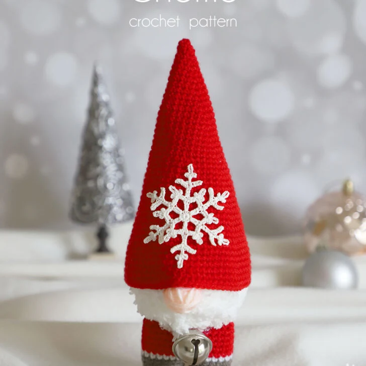 Free pattern of an Amigurumi Crochet Gnome Pattern with a snowflake on the hat. It's beautiful & perfect for your home decor during the holiday season.