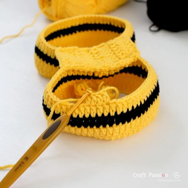 crocheting the body of the bee romper from bottom to top.