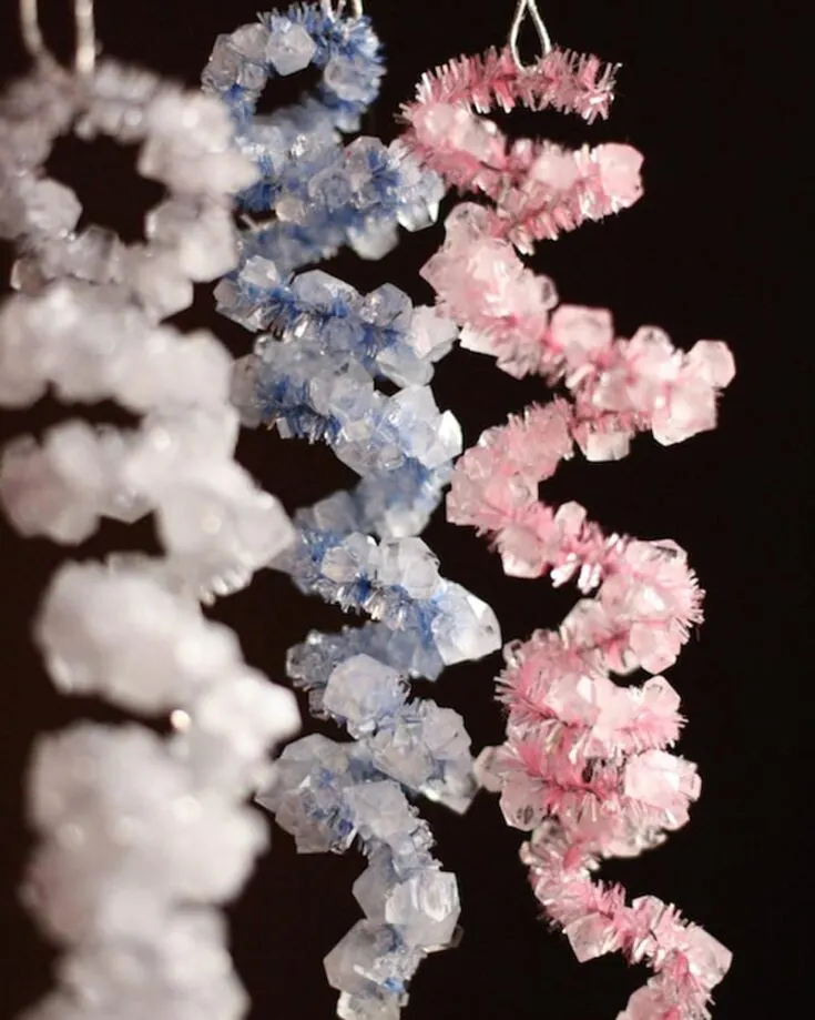 Decorate your Christmas tree with colorful crystals on pipe cleaners with this simple science experiment tutorial. Kids will love watching crystals slowly form, creating beautiful and unique designs.