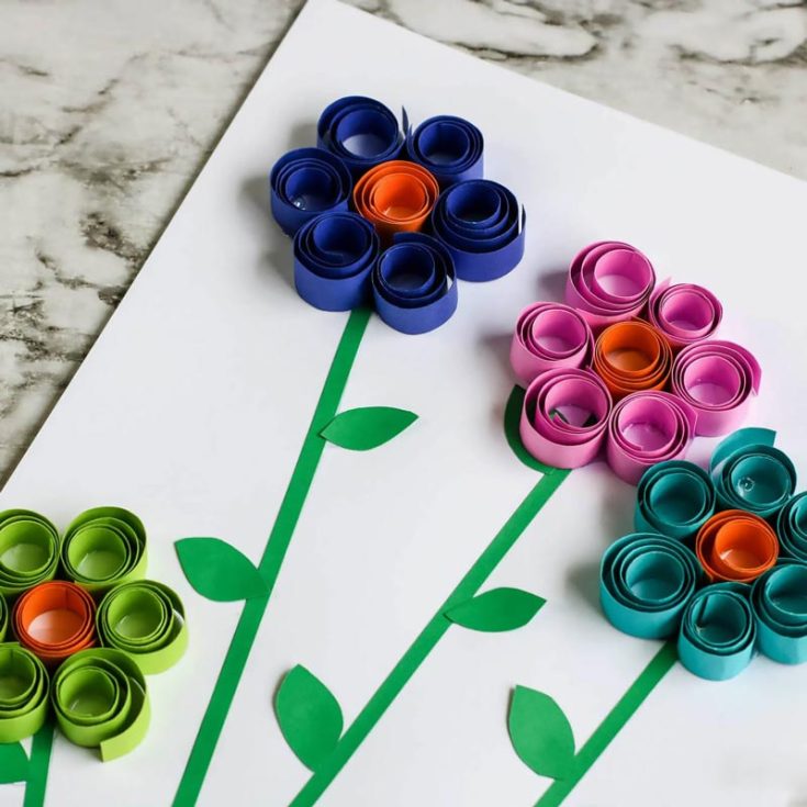Whip out some construction paper, scissors, and glue. Time to get handy! Curl those papers to form 3D-looking paper flowers that your kids will be proud of. You can even use different colored papers to personalize it!