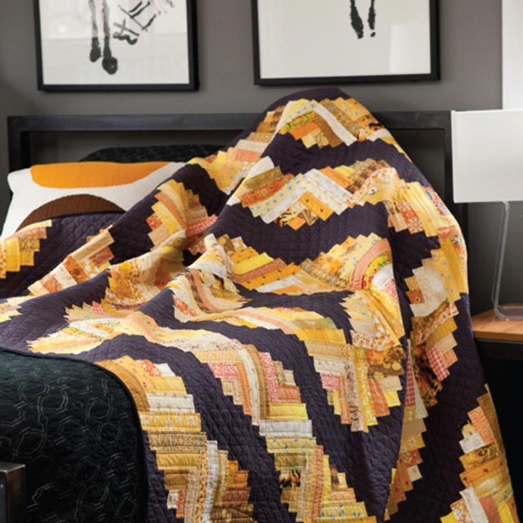 This lovely curved cabin quilt adds a funky twist to your quilting repertoire! Though it's a paid pattern, the design is totally worth the price, at only $7.99. It&rsquo;s a stunning example of utilizing the super-scrappy quilt technique and is beginner-friendly, too. The finished size is 72&rdquo; x 90&rdquo;.