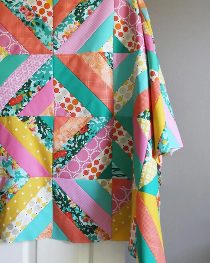 Learn how to make this gorgeous Diagonal Strip Quilt by following the tutorial! Though it&rsquo;s a beginner design, it&rsquo;s a bit more complicated for new quilters to tackle as it&rsquo;s an advanced beginner project. However, this tutorial will guide you through creating a gorgeous and vibrant quilt using diagonal strips, allowing you to showcase your creativity in a quilt. This pattern offers five sizes as follows: Baby (38 &frac12;&rdquo; x 46 &frac12;&rdquo;) Crib (46 &frac12;&rdquo; x 54 &frac12;&rdquo;) Small throw (54 &frac12;&rdquo; x 69 &frac12;&rdquo;) Large throw (62&rdquo; x 77 &frac12;&rdquo;) Twin (69 &frac12;&rdquo; x 85&rdquo;)