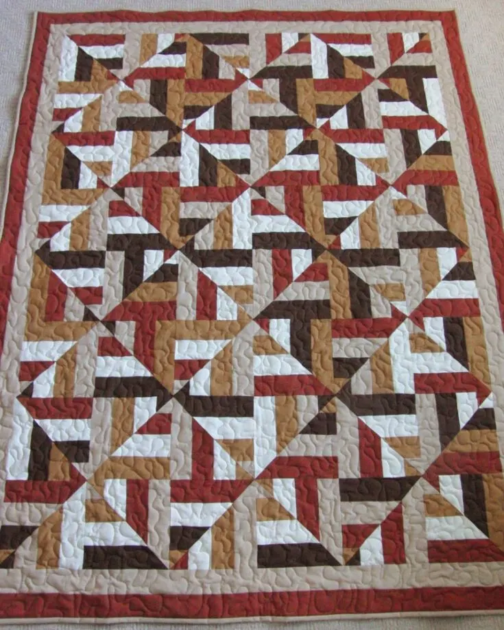 Let your quilting journey blossom with this breathtaking quilt pattern! The diamond shape of the design just elevates the entire look. Here&rsquo;s a pro tip: you can change the diamond sizing to smaller or larger by using different numbers of strips. So, join us in the fun of making this 3D design that will get you tons of compliments on your fantastic artwork. Size: 54? x 68?