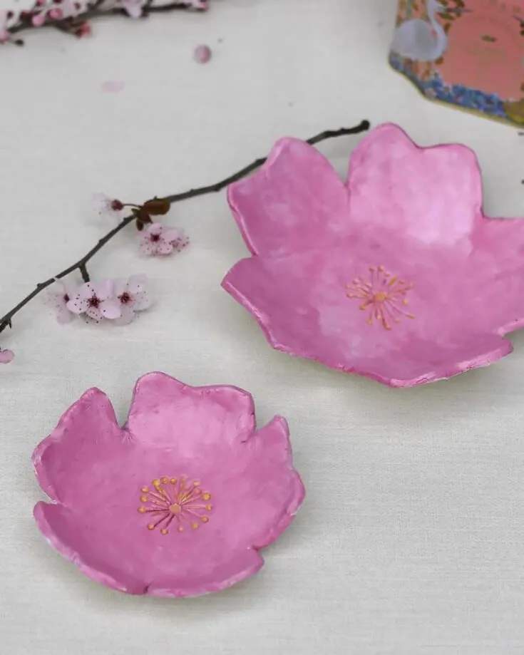 Shake your creativity by making these wonderful air-dried clay trinket dishes into cherry blossoms! Not only are they decorative, but they're also fantastic at storing your jewelry in place.