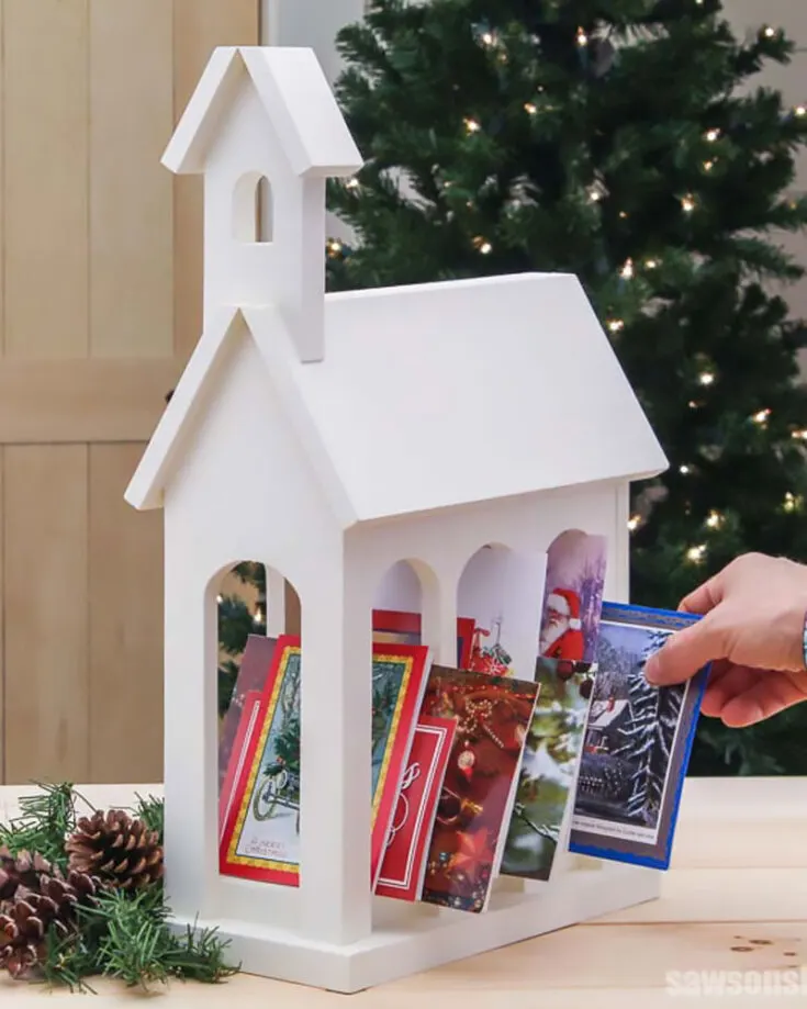 Do you have so many cards that you aren't sure where to store them? Make this fashionable Christmas Card Holder. It resembles a church with its white-colored finish embodying the meaning of holy! Try this out to display your cards and also make it a form of decoration.