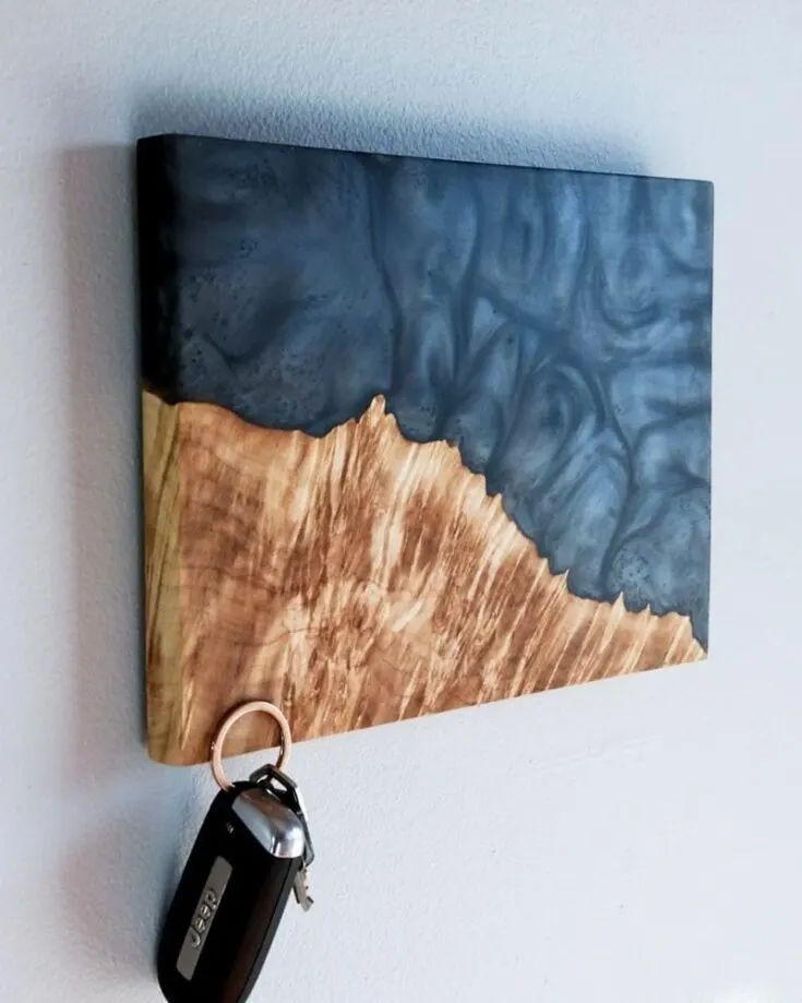 Follow this video for step-by-step instructions on creating this epoxy resin and wood art piece that doubles as a secret magnetic key holder.