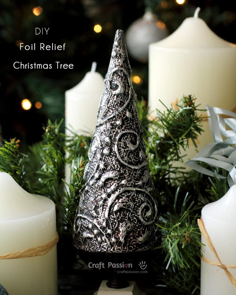 Make a chic elegant foil relief Christmas tree to decorate your home. Easy DIY Christmas craft with cone mache, dimensional glue, aluminum foil & shoes polish.