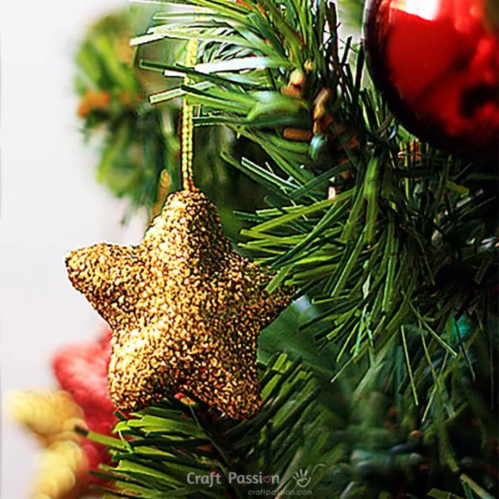 DIY glitter star by adding glitter to a foam star for a sparkling effect. Great ornaments for Christmas decors, adding a touch of twinkle festive display.