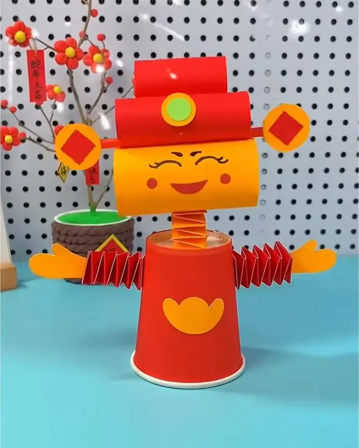 Making a God of Wealth with a paper cup and colored paper is such a fun and easy craft for Chinese New Year! It&rsquo;s a creative way to bring good luck and festive vibes to your home. Grab your supplies, get crafty, and let the wealth roll in!