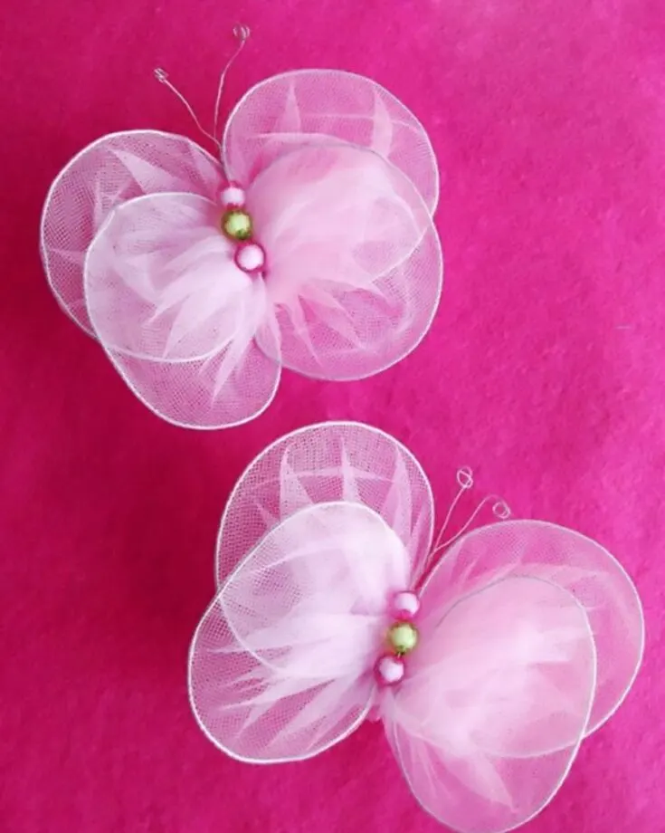 Tulle is a type of netting made of small-gauge thread, netted in a hexagonal pattern. How cool and unique is that? This tutorial will teach you to make realistic butterflies with the netting resembling the wings.