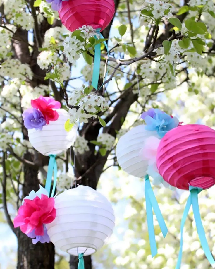 Check out these vibrant florals adorned on paper lanterns! They make excellent decor on your porch to usher in some blooms to your home and are effortless to make.