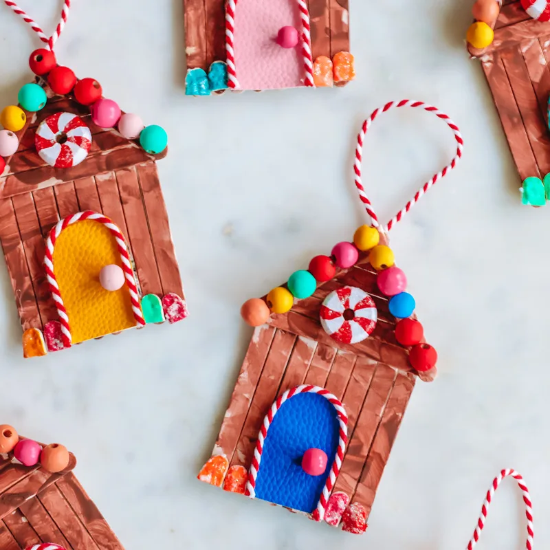 Introducing this Popsicle Stick Gingerbread House! Although it says popsicle, you can't eat it! It is only for decorations and we understand why as it is so fashionable!