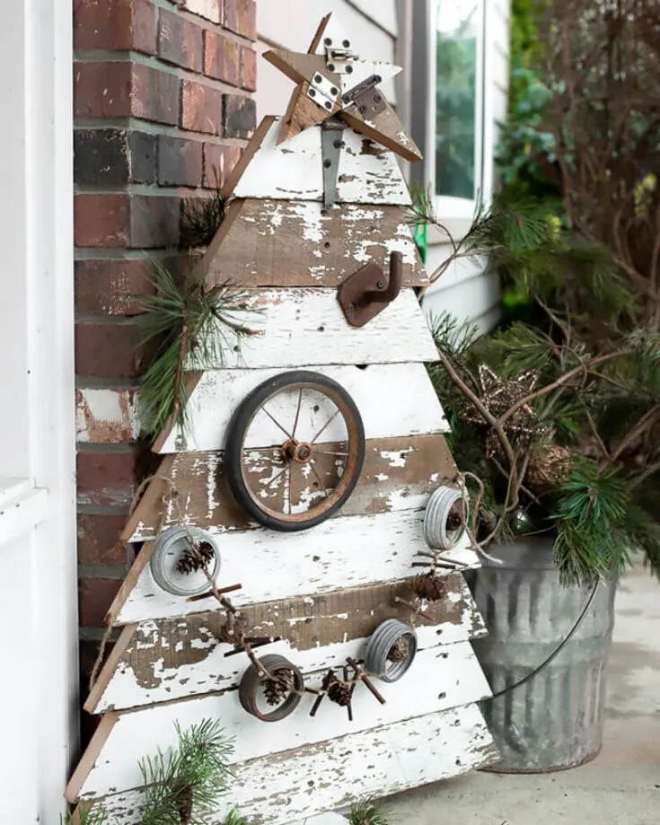 This tree is so interesting. It adds different meaning to Christmas decor showing that anything can serve as decoration! Use unwanted materials to create a rustic tree that defies the traditional Christmas decor.