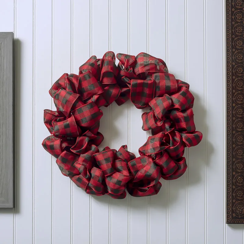 Want an easy DIY Ribbon Wreath in three easy steps? This tutorial is for you! Use different colored ribbons to make an array of colors, or just stick to one unison color.