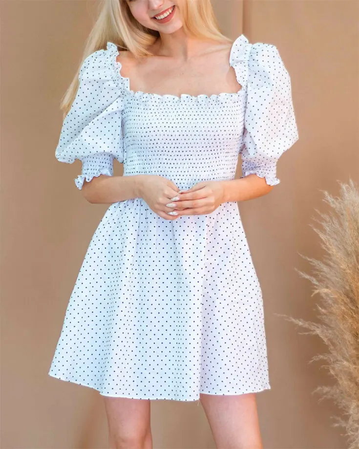 Here's a whimsical mini dress you could sew yourself this spring! It features a smocked bodice and puffed sleeves with ruffled edges that run along the neckline. This pattern gives you the option of making a midi or maxi dress. It's also available in US sizes 2-12.