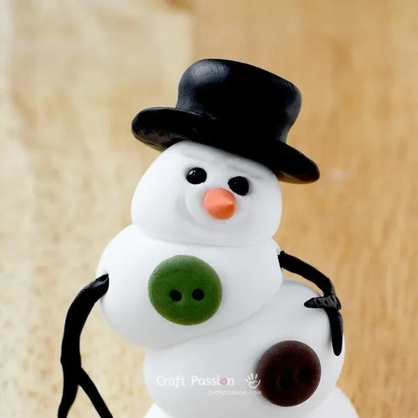 wear the hat onto the diy snowman's head