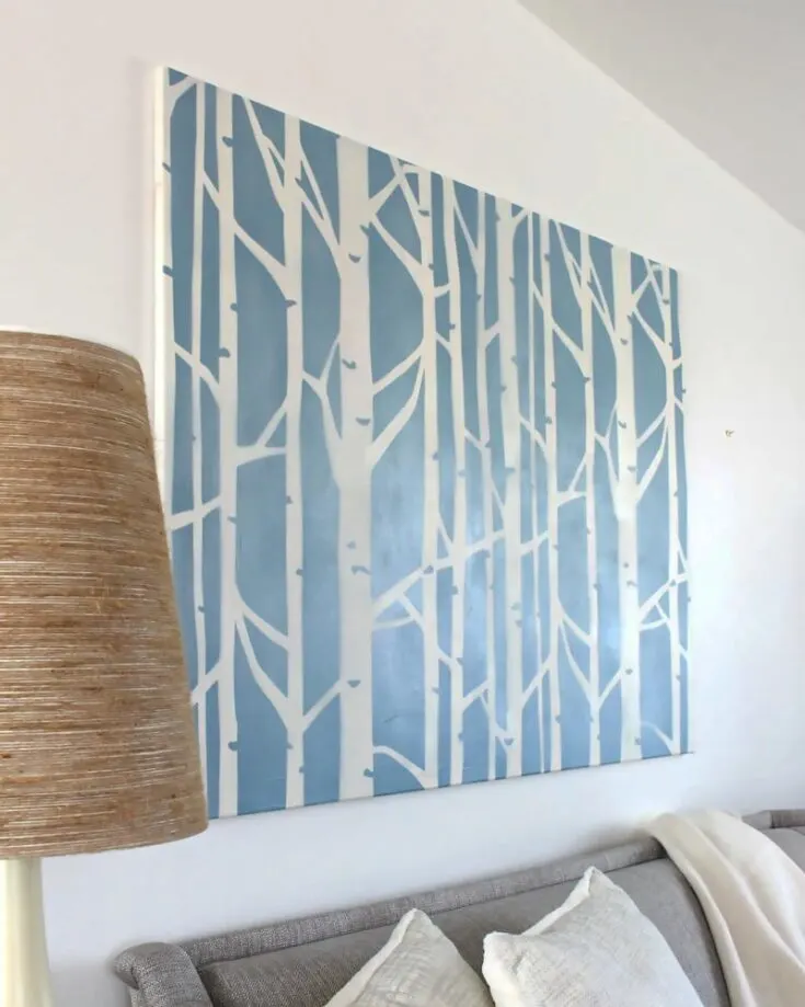 These stenciled artworks are gorgeous. They mimic a birch tree forest, which adds a rustic, natural feeling to your home while making it cozy. Use this idea to bring nature into your home!