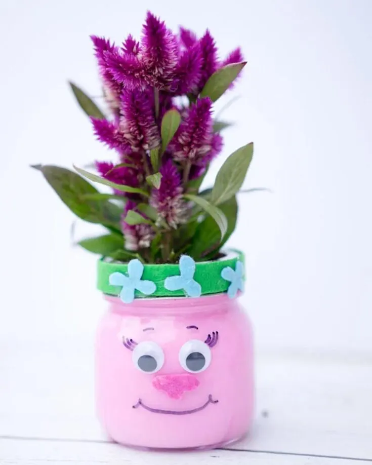 On the topic of recycling, mason jars are your perfect companion. If you have some sitting at home and are waiting to be used, now&rsquo;s your chance to upcycle them into this hilarious troll's mason jar planters. Just add some googly eyes and a smiley face to complete the goofy look.