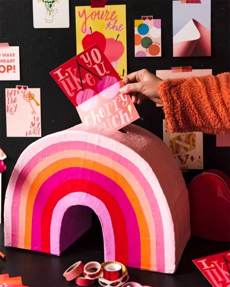 Use all the rainbow colors to make this rainbow arc that stores your personalized cards. It's a fun activity for the kids to make for their moms or dads, but they may need some help and patience in hot-gluing the cardboard pieces into a multicolored arc.
