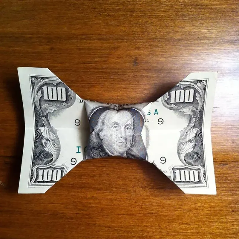 Now that we've looked at sunglasses, let's go further down to check out these fabulous dollar bill origami bowties! It also doubles as a ribbon that you can put on gift boxes.