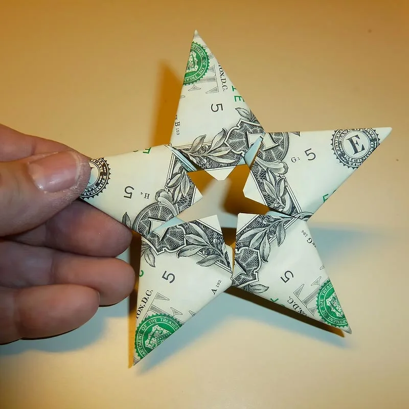 Your eyes will shine as bright as this dollar bill origami star after trying it out! It's a simple and fun craft that you can make anywhere, and since the steps are so easy to remember, you'll find yourself with a handful of stars before you even realize!