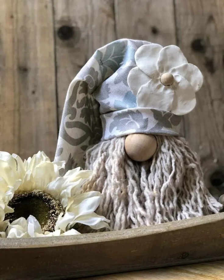 Who knew a mop head could be so fun? Create a playful gnome using supplies from the dollar store; it's a budget-friendly craft that adds a mischievous flair to your holiday decor!