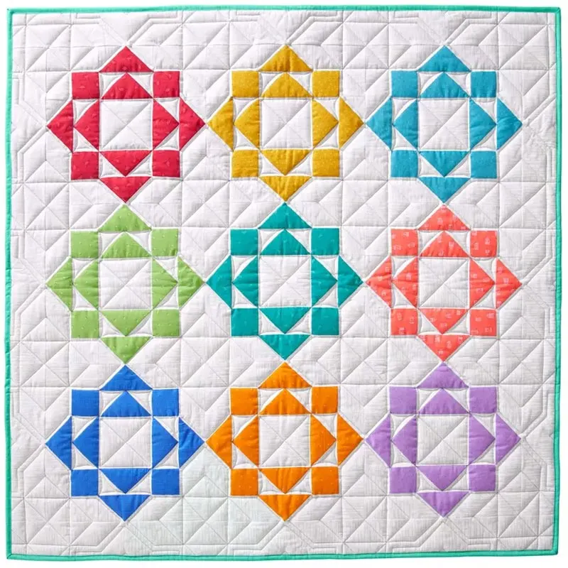 Make naptime extra cozy and cuddly with this rainbow dream catcher baby quilt pattern! This design is beginner-friendly and fit for all newborns! This pattern will bring warmth to any room using bright and tonal fabrics, and the finished size is 42 &frac12;&rdquo; x 42 &frac12;&rdquo;.