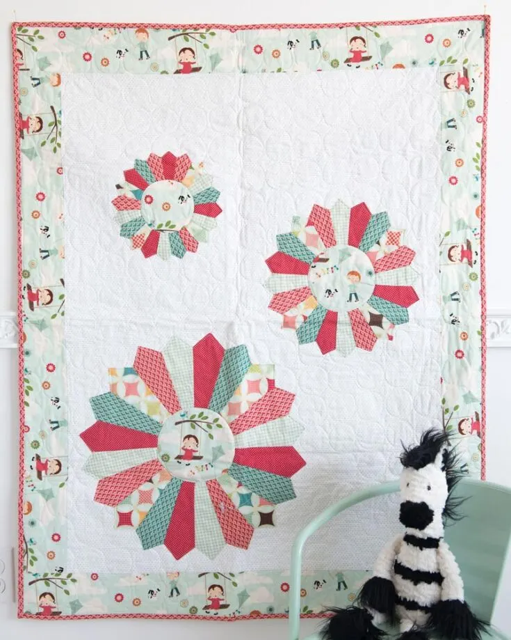 This fantastic baby quilt design can be made for both baby boys and girls! The Dresden baby quilt pattern has written instructions to guide you into creating this fantastic artwork! Also, this delightful design is perfect for adding a touch of vintage flair to your baby&rsquo;s nursery. The finished size is 38" x 48".