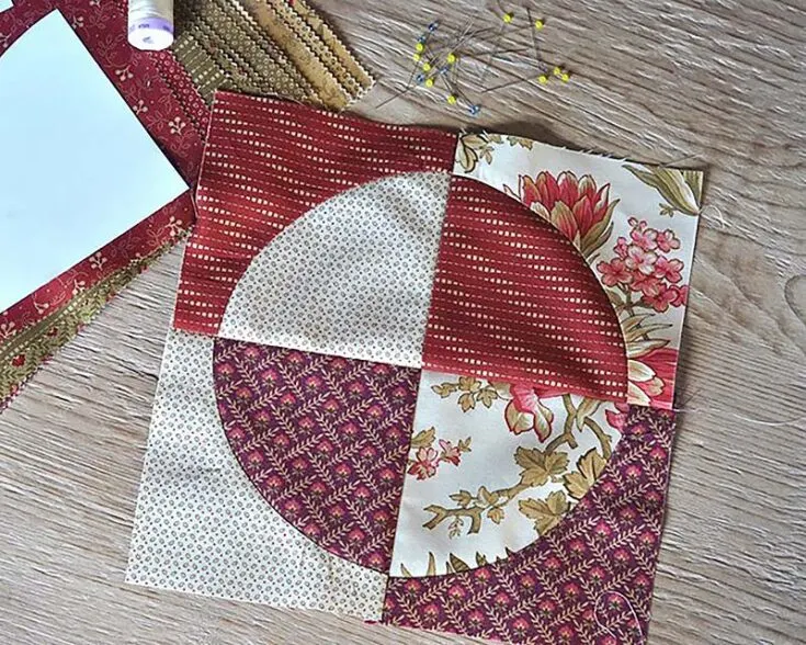 A key trait of a drunkard's path pattern would be the graceful arcs of the quilt block pieces that smoothly transition into the next. Producing a few of these would be an effective way to practice sewing curves and winding stitches.