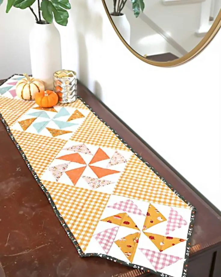 Learn how to make a table runner with this beautiful and minimalistic design. It features the traditional Dutchman's Puzzle quilt block with mini Flying Geese blocks. Though it may sound challenging, this tutorial will teach you everything you need to know to make this lovely design successfully.&nbsp; Table runner size: 11 &frac12;" x 34 &frac12;"
