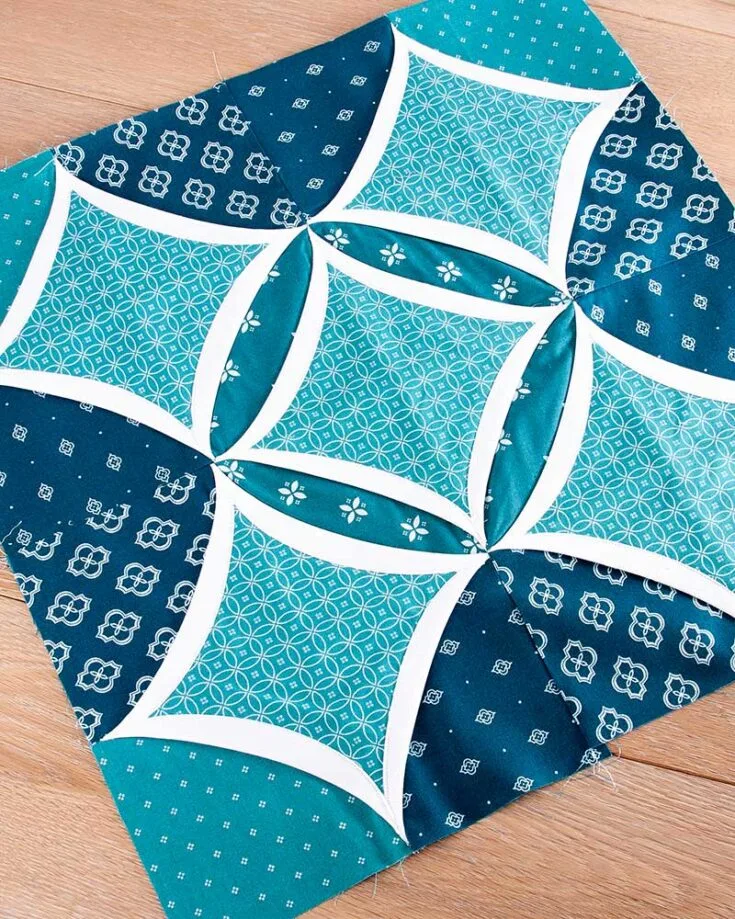 This Cathedral Window quilt block tutorial is slightly less challenging than the previous one as hand-sewing isn't required, and there's less folding, too. Yet, it's equally as beautiful!