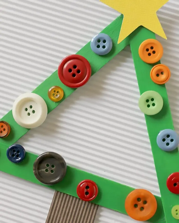 Here is another Christmas tree ornament. We still can't get over the fact that we are hanging Christmas trees onto a Christmas tree! Anyway, this one is super easy using buttons that you probably have lying around. Use them and get crafty!
