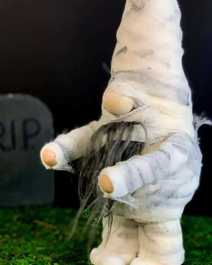 We have a Witch Gnome; how about giving it a friend with this Mummy Gnome? Touch up your house with adorable Halloween decor by following the tutorial below! It acts as the perfect doorstep greeter.