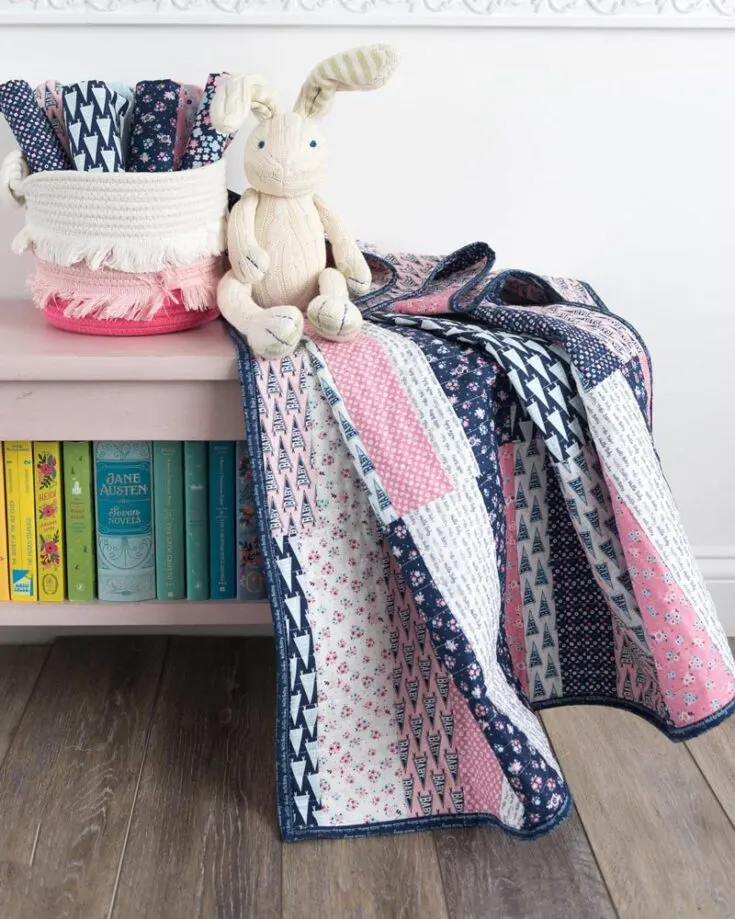 If you want a scrap-busting quilt project, this design is just for you! Though the baby quilt pattern uses pink fabric, you can swap it with other colors to match your baby&rsquo;s taste! With clear instructions and helpful tips, you can make a baby-sized quilt at 37&rdquo; x 45&rdquo;.