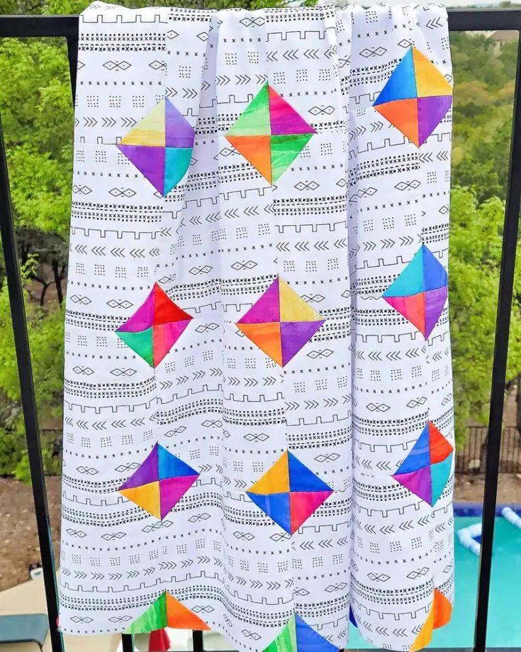 Make a vibrant quilt with this Easy Snowball Quilt pattern! This pattern features large square blocks adorned with smaller contrasting and colorful squares in each corner, creating a delightful snowball effect. It&rsquo;s easy to put together using the shortcut snowball block method, and the quilt is made in two sizes as follows: Throw (30&rdquo; x 30&rdquo;) Twin (80&rdquo; x 80&rdquo;)