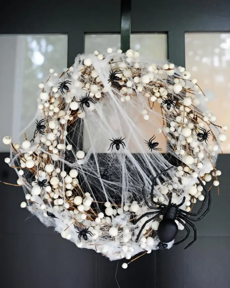 Spin a web of spookiness to your front door by making this Easy Spider Wreath, because what's Halloween without creepy crawlers? Learn to make it by clicking the link below!