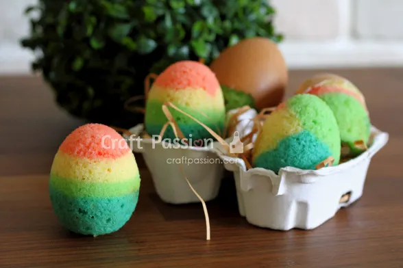 Bake quick Easter cakes using eggshells. Mix batter with various colors for colorful mini rainbow cakes. Kids can crack them open on Easter Day.