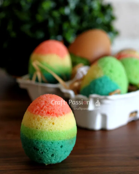 Bake quick Easter cakes using eggshells. Mix batter with various colors for colorful mini rainbow cakes. Kids can crack them open on Easter Day.