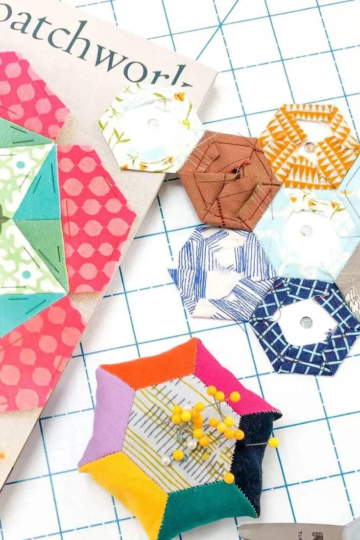 GIve this English Paper Pieced pattern a try! By stitching together a few hexagons using your favourite scrap fabric, you can make a fun cushion that is filled with walnut shells or rice for some proper weight.