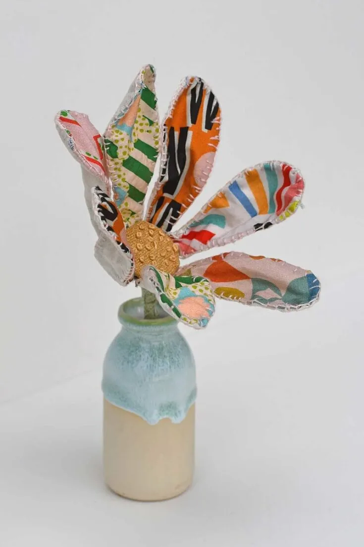 Use your scraps to make these whimsical and colorful fabric flowers that are sure to brighten any home. They're unique and easy to make, just be sure to grab some floral wire before you begin!