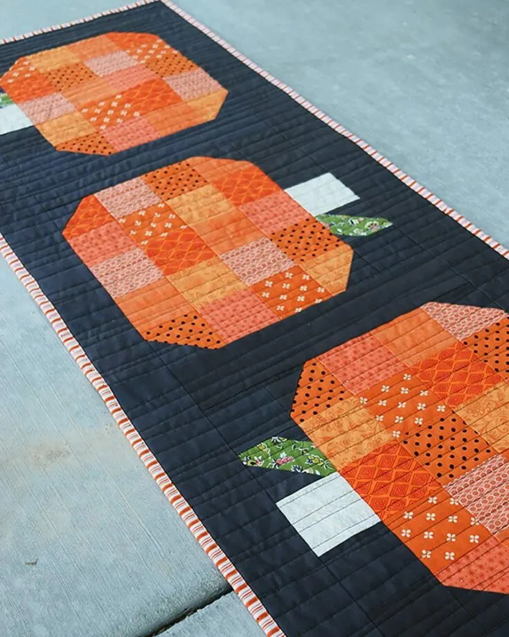 Learn to quilt this runner that is adorned with pumpkin blocks! It's the perfect fall decor for the upcoming season and adds warmth to the cold weather. Usher in the seasonal spirit with this pumpkin runner.&nbsp; Table runner size: 17 &frac12;" x 46 &frac12;"