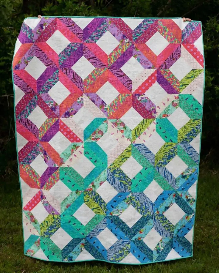 Check out this fantastic and visually pleasing quilt design that uses a very simple block technique! This tutorial comes with two layout options for you to choose from, and it's made of two prints and a background fabric. The finished size of this piece yields a 64" x 80" twin quilt.