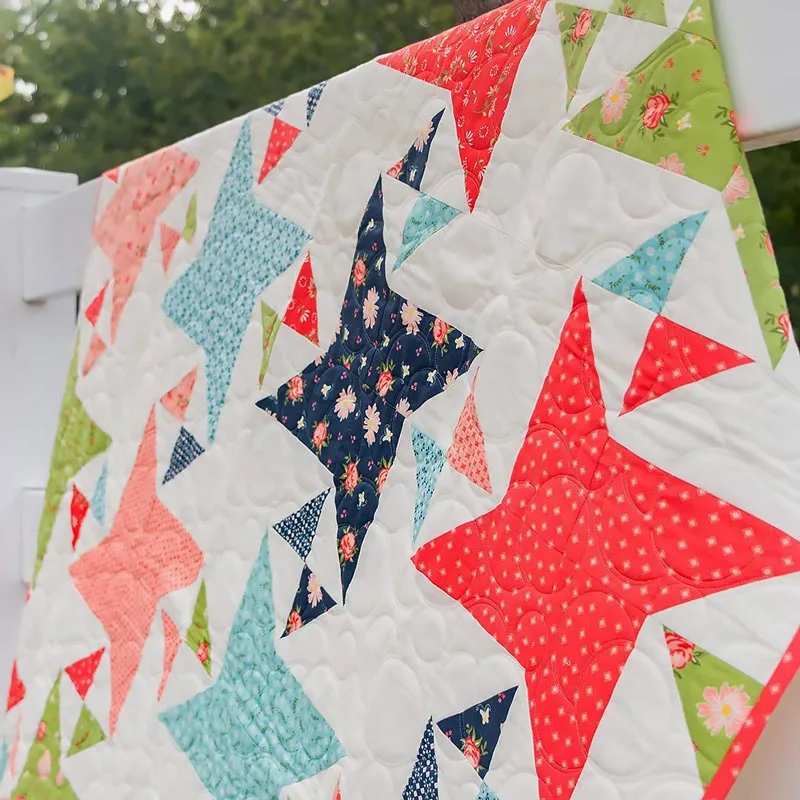 Don't you love how calming the hues are in this quilt design? It brings the colors of the garden to your home decor! This beautiful piece has step-by-step instructions for making a 52 &frac12;" x 65 &frac12;" quilt using triangle paper for fast and accurate HST piecing.&nbsp;
