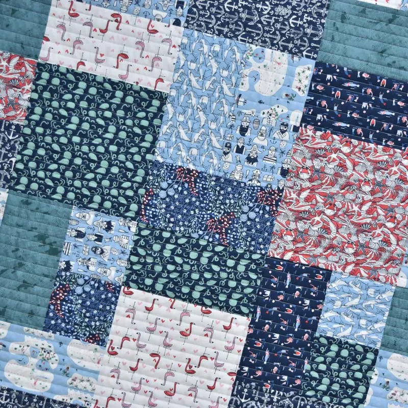 Check out this gorgeous, effortless design that uses an entire fat quarter with minimal leftover scrap! Isn't that amazing? This pattern is great for larger-scale fabrics and prints, and it's versatile. Though this quilt measures approximately 70" x 90", you can always upsize it by adding more FQ pieces!&nbsp;