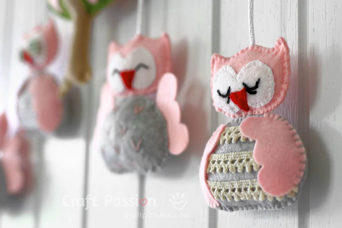 Create an adorable DIY baby mobile with our free sewing pattern featuring cute owl characters & a lovely tree design. Perfect nursery decor & baby shower gift!