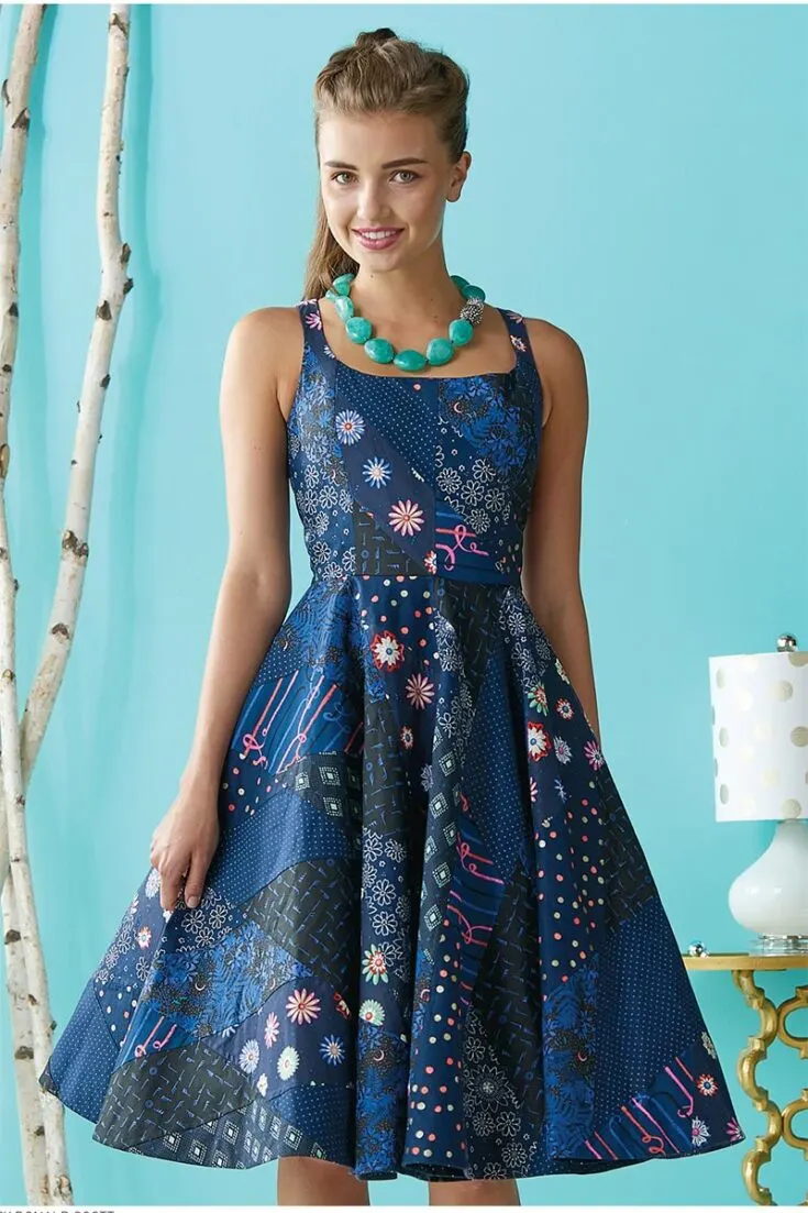 It's a lot of fun to incorporate piecing into a standard fit-and-flare silhouette with a full skirt. The patchwork on this garment is paper pieced, and the circular skirt is made up of four quadrants, each of which is made up of six pieced strips. The skirt strips are arranged differently in each of the four corners to achieve the desired graduated pieced look. This sophisticated dress is available in sizes ranging from XS to XL, so almost anyone can try it on!