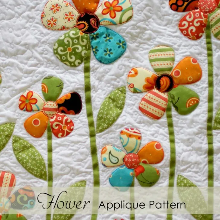 Download free flower appliqué patterns complete with leaf and stem to complete the Secret Garden Appliqué Quilt or for other sewing projects.