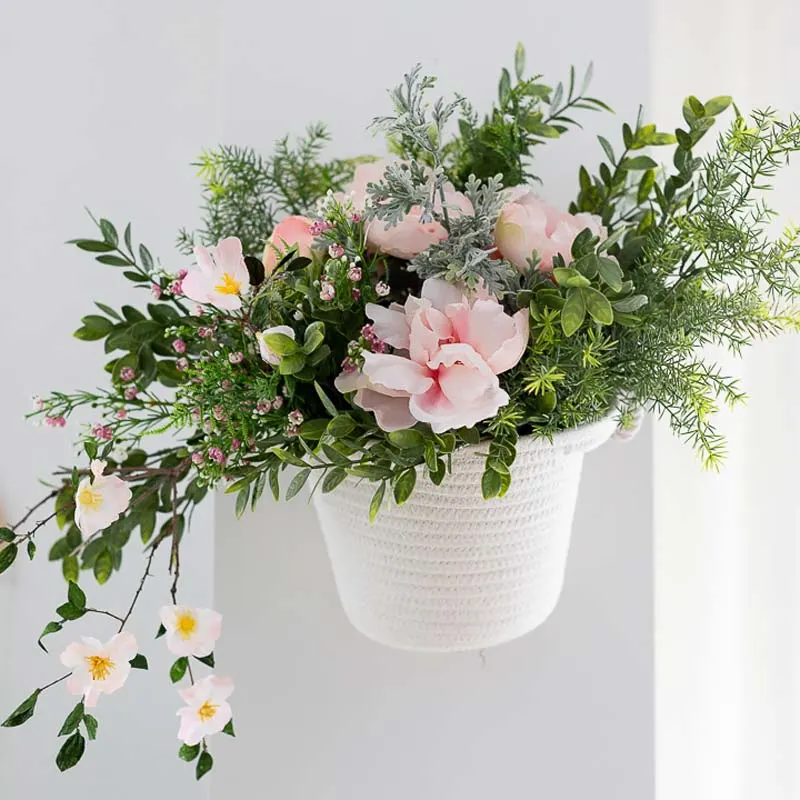 Spring is finally here! Let&rsquo;s welcome spring with this beautiful hanging flower basket complete with pink florals and green leaves you can hang in your living room. You can easily find most of the supplies from the nearest Dollar Tree. As for the crepe blossoms, check out the tutorial by Craftberry Bush.